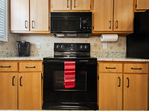 Electric oven and stove top combination and microwave.