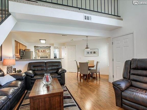 Living room with loft above