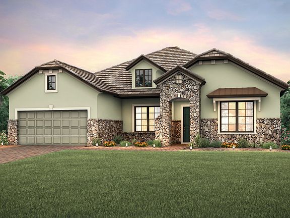 Exterior EC2B with decorative dormer and beautiful stone