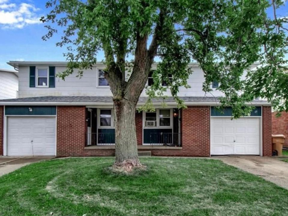 Right unit with private garage with driveway and basement.