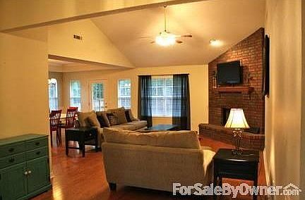 Living room : This living room is very large, yet comfy! It is open to the dining room.