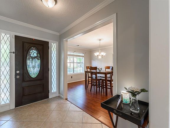 Upon entering, you are greeted by this warm, inviting foyer that immediately makes you feel at home.
