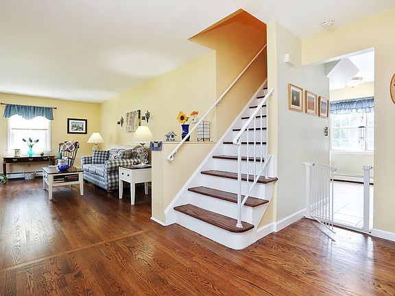 Entry Way And Living Room Highlighting Wood Floors