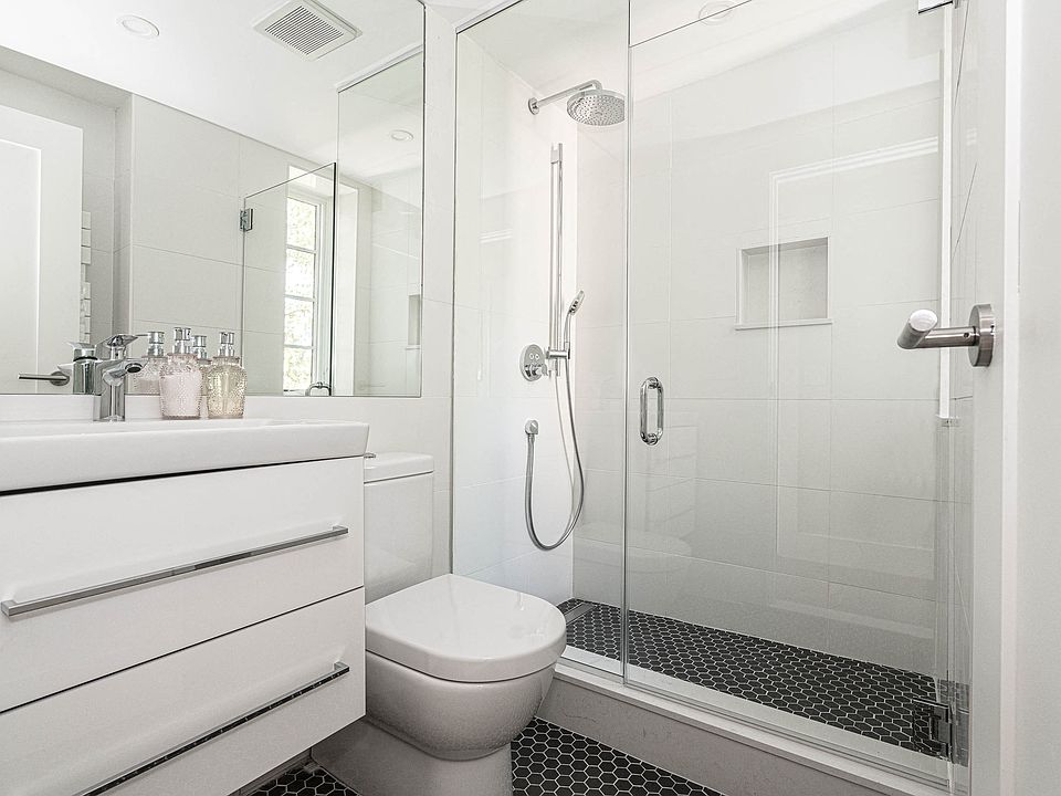 stylish bathroom with chrome fixtures and a rain shower
