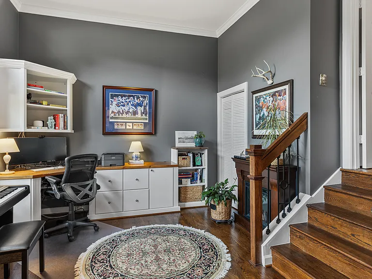 Spacious workspace with huge windows, a keyboard piano, and a dedicated workspace with an extra monitor + printer.