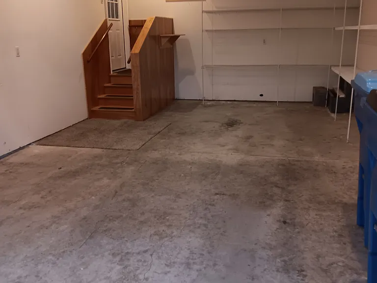Garage, shelving and entry to kitchen