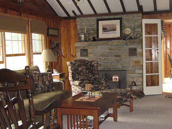 Stone fireplace in large living room