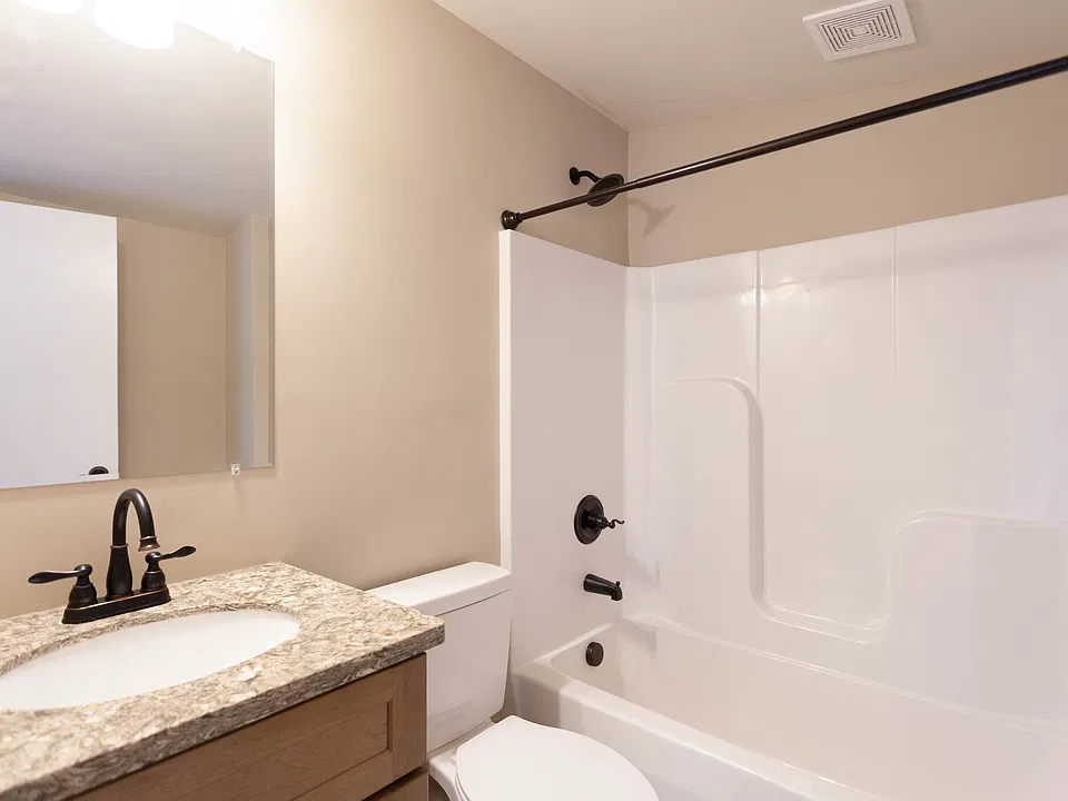 Community bathroom located at the back of the building.