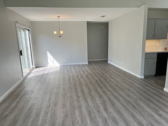 Spacious, open concept living room, dining room, and kitchen.
