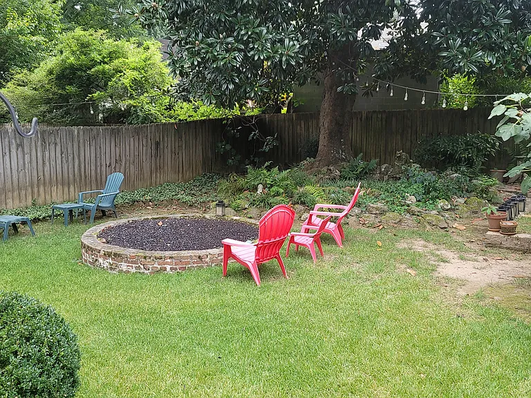 Natural Gas Firepit in backyard visible from back window