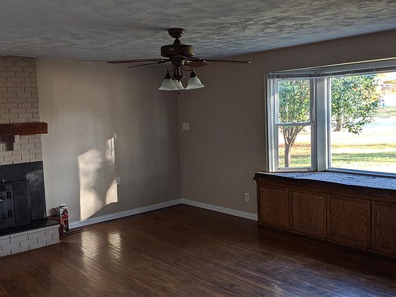 Living Room; bay window seat and wood stove