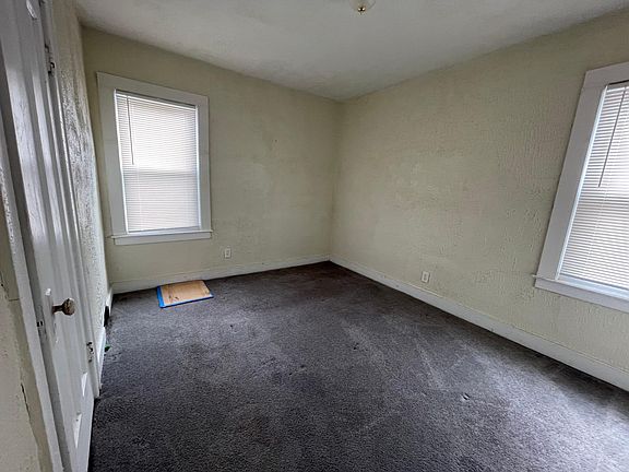 Bedroom -- Will look so much nicer with our light gray paint and new carpeting. Being done now.