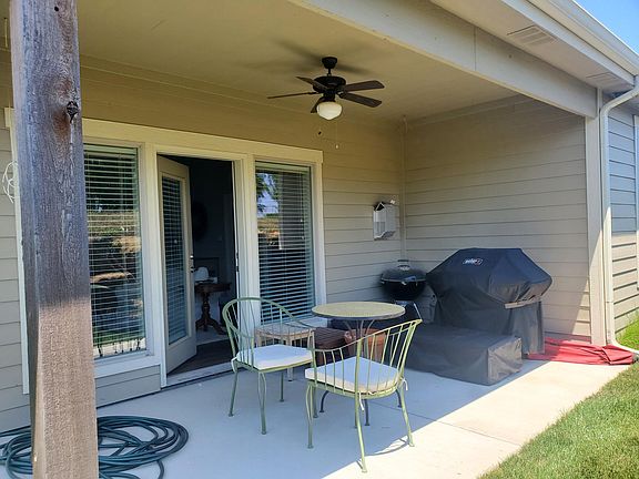 Rear covered patio with ceiling fan.