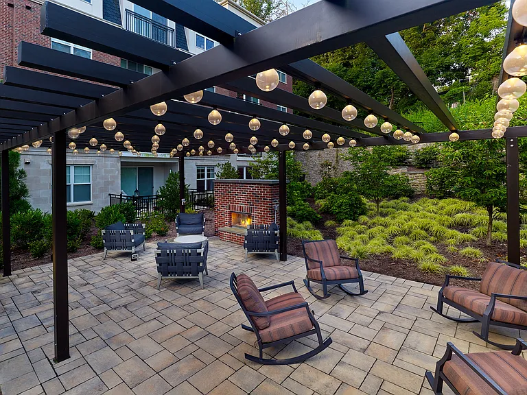 Relax in style in our secure, private outdoor patio, featuring ambient lighting and a cozy fireplace.