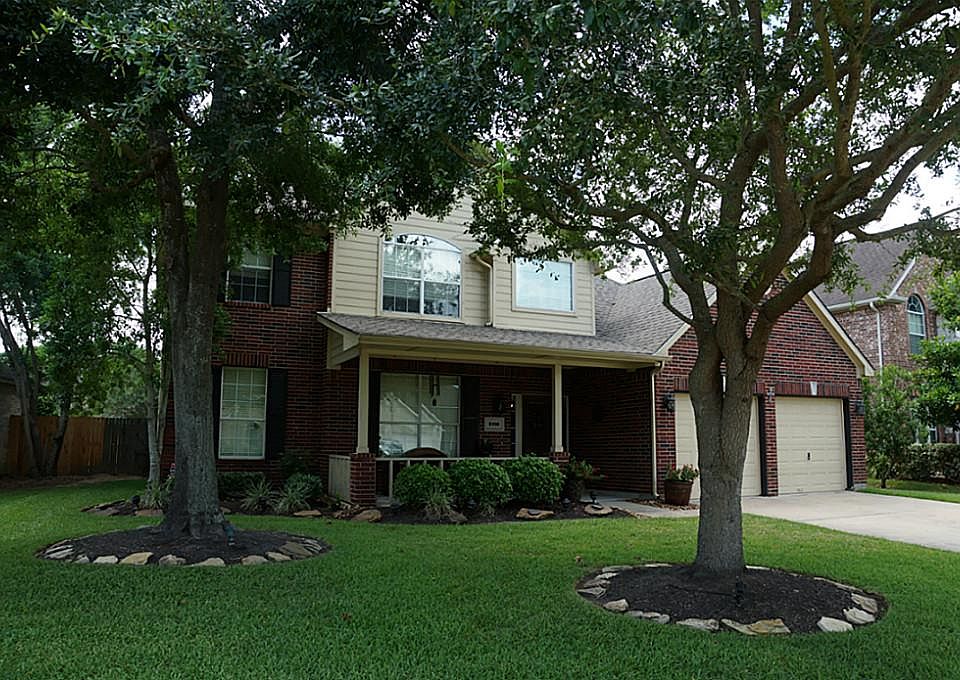 Gorgeous home nestled amongst these fantastic oaks!