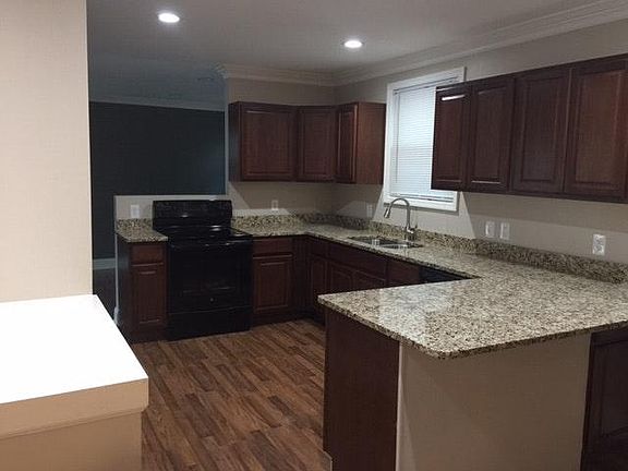 All new kitchen with dishwasher, stove, fridge and disposal