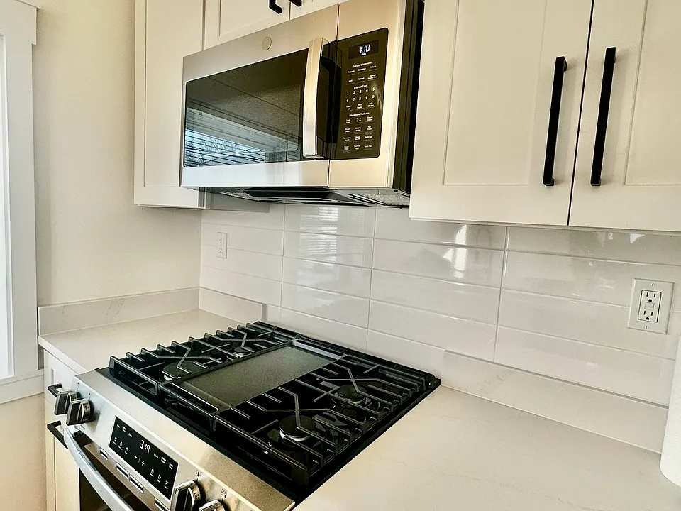 Previous work done by the same developer. Quartz countertops, full size stainless steel appliances. In-unit laundry, mini splits. Final product to be the same quality.