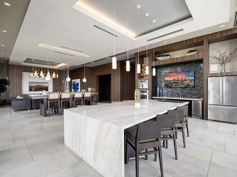 Resident lounge featuring a suite of premium appliances and both lounge and dining seating areas