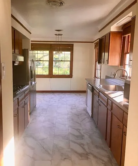 View of front kitchen window by eating area.