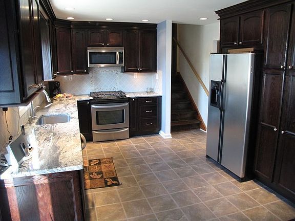 Kitchen with Granite Counter Tops and Stainless Steel Appliances