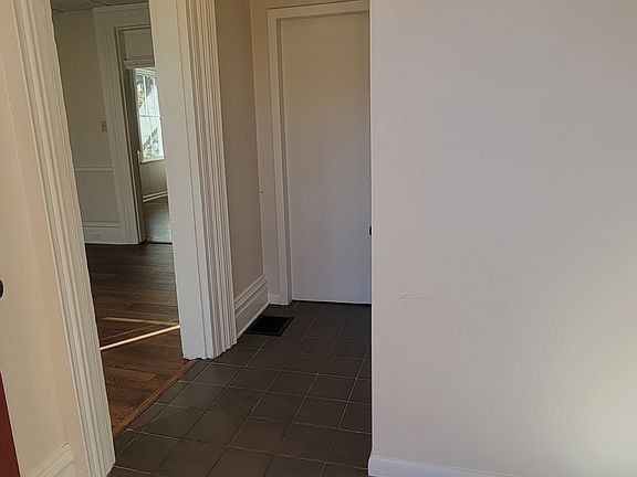 Entryway, which comes with a closet is between the bedroom and living/kitchen space