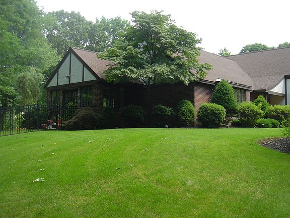 front and side across expansive lawn