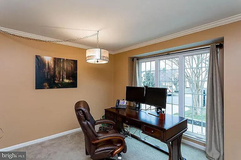 This is the office off the center hallway on the main floor, it has been repainted and the lights have been replaced.