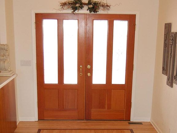 Beautiful Inlaid Wood Entry with Leaded Glass Double Doors