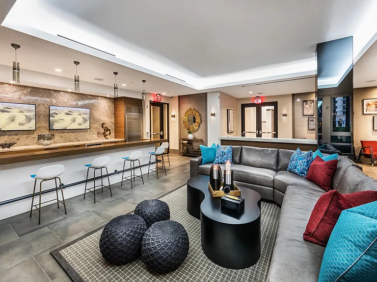 Clubroom with bar seating and TVs for relaxed social time.
