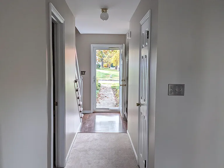 Stairs to unfinished basement on left