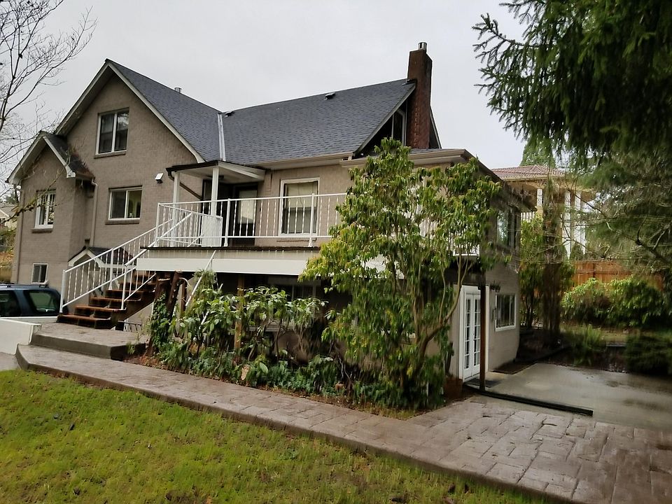 The main suite entrance is on the 2nd floor up the stairs and the MIL suite entrance (white french door) is on the left side of the house.
