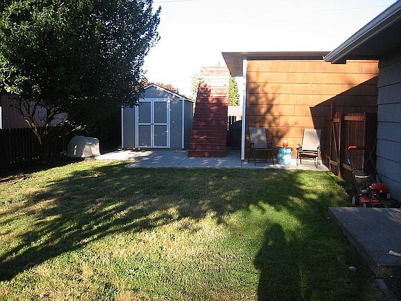Backyard,shed and stairs to deck above garage