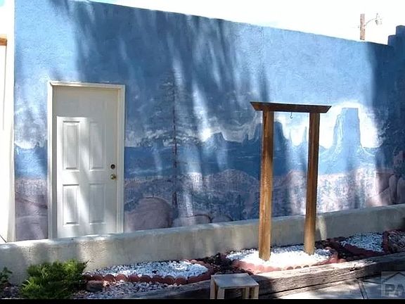 Southwest mural on side of garage