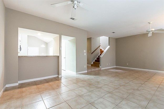 Living Room transitions into kitchen with a small counter area.