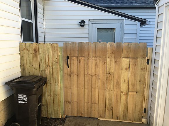 Gate to the fenced back yard