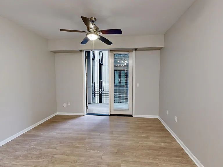 Apartment living room with wood-style flooring.