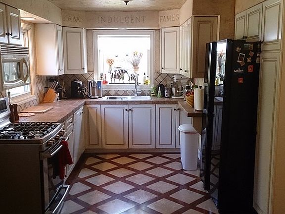 kitchen with window overlooking backyard
