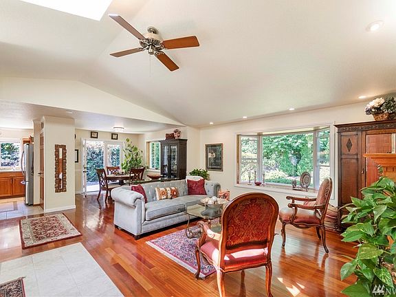 Family room picture showing access to kitchen and formal dining room. 
