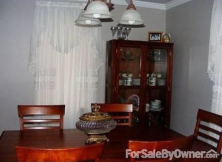 Dining Room
						:
						Bedroom or Dining Room. Beautiful window dressings throughout home.