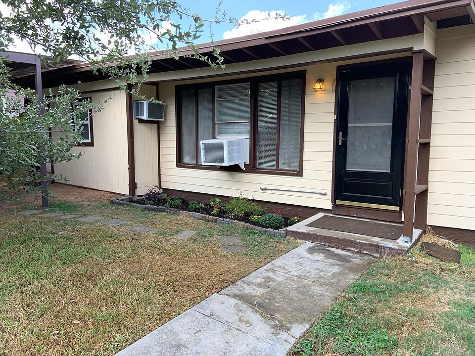 Front view of house with carport off to the right