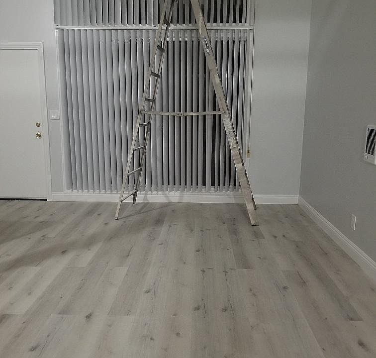 Living Room has new flooring and high ceiling
