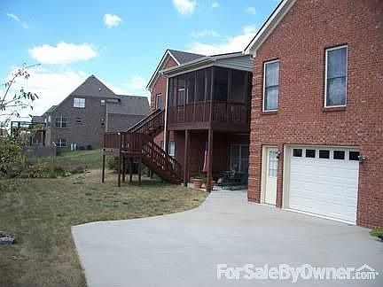 Back of house : Back of house with patio, screened porch, 3rd garage/workshop