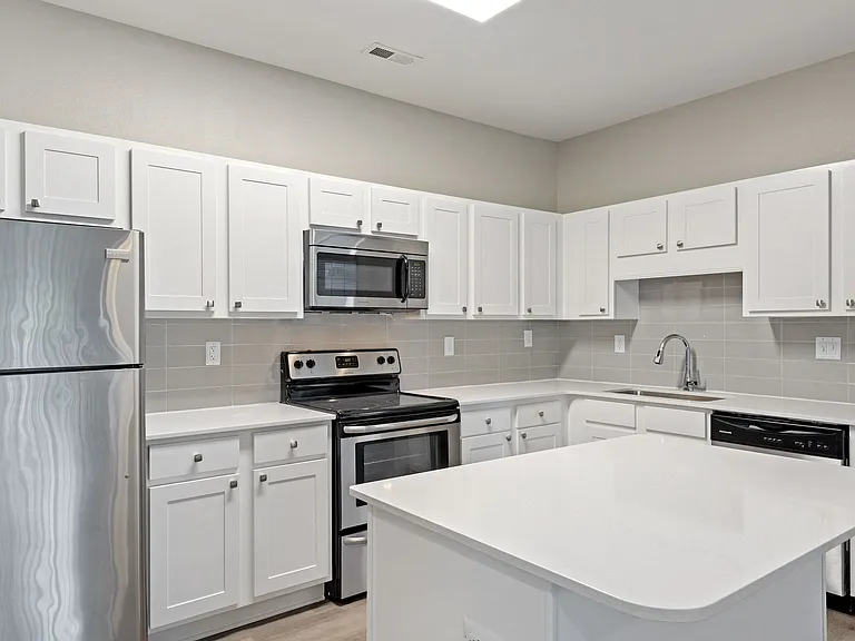 Renovated kitchens include quartz countertops.