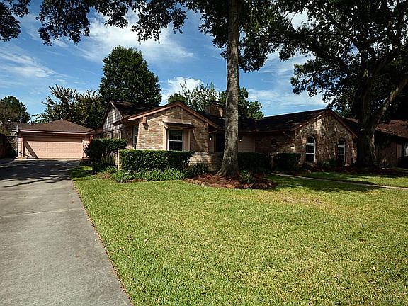 The home has a detached garage and wonderful garden. Gorgeous curb appeal in this quiet neighborhood.