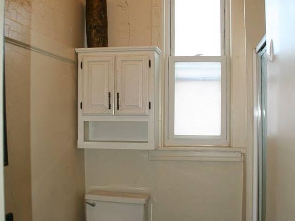 Bathroom - shower in the back on the right side of the image