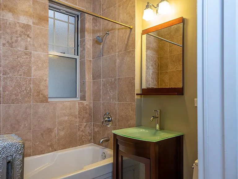Spa-like Qualities! Top to bottom beauty. Beautiful cabinetry, Sleek European-styled sink, Deep tub, Hotel-like finishes.