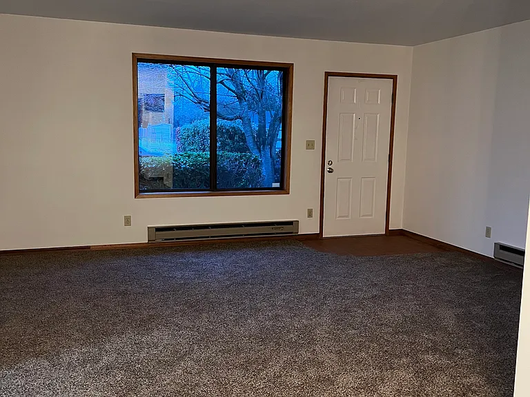 Living room. Entry at front door is tiled (terracotta color)