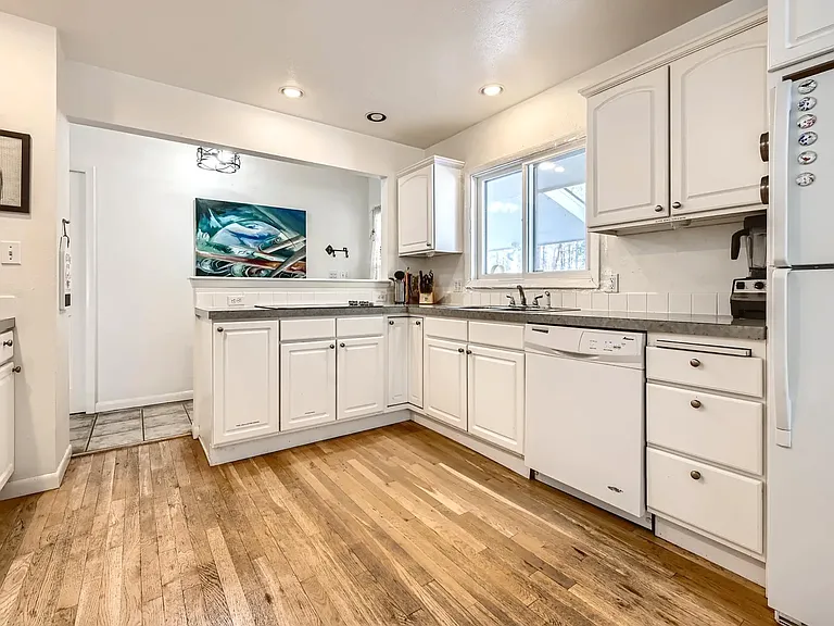 Large spacious upper level kitchen, plenty of cupboard space and storage and pantry space.
