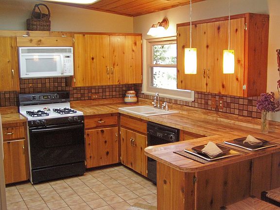 Big, bright kitchen with eat-in counter.
