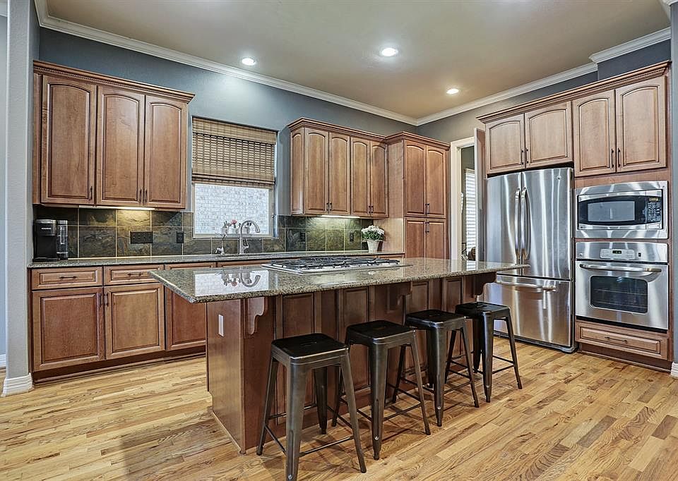 Imagine entertaining at this amazing abode at 2719 Lakeside Dr. Awesome kitchen has stainless appliances, maple cabinets and large granite island/breakfast bar.